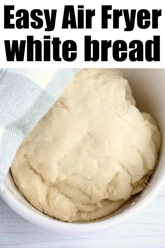 A bowl of white bread dough covered with a cloth, with text reading Easy Air Fryer Bread—solid for quick and good homemade loaves.