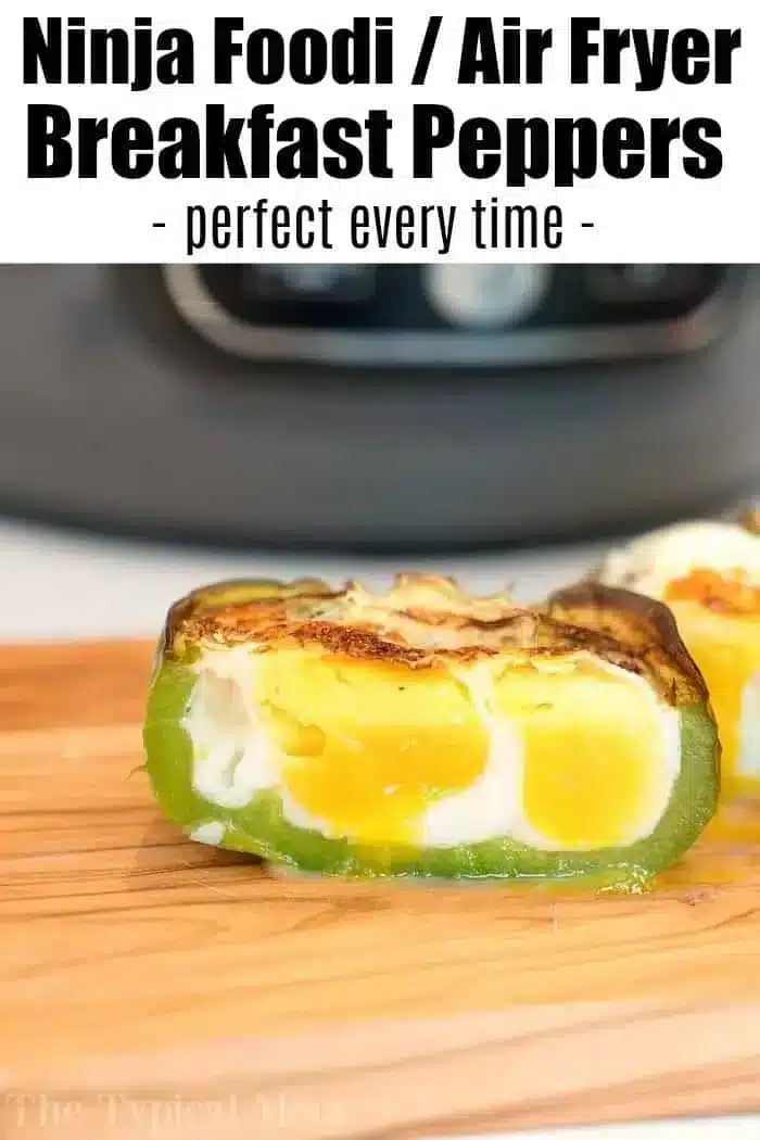 A slice of green bell pepper stuffed with fluffy cooked egg, lightly browned on top, rests on a wooden surface. The text at the top reads, "Air Fryer Breakfast Stuffed Peppers - solid every time.