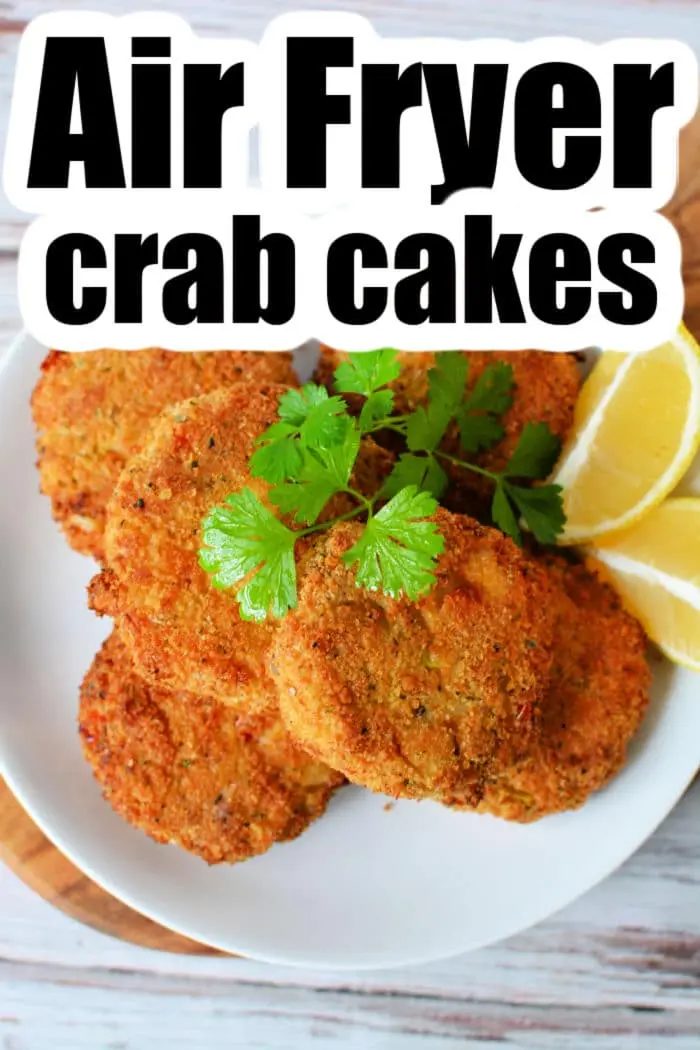A plate of Air Fryer Crab Cakes is garnished with cilantro and served with lemon wedges. The text "Air Fryer Crab Cakes" is prominently displayed at the top.
