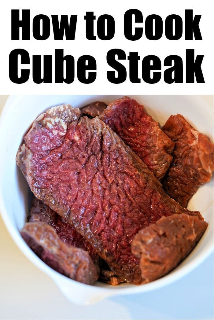 Raw cube steak in a white bowl, with text How to Cook Air Fryer Cube Steak at the top.