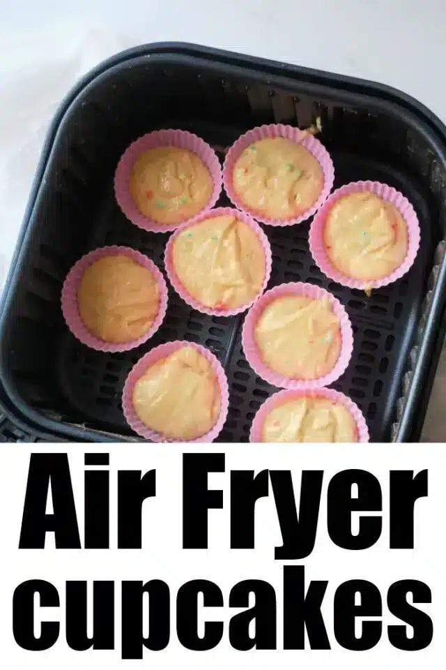An air fryer basket holds eight colorful silicone cupcake molds filled with cupcake batter. The text "good Air Fryer Cupcakes" is prominently displayed at the bottom of the image.
