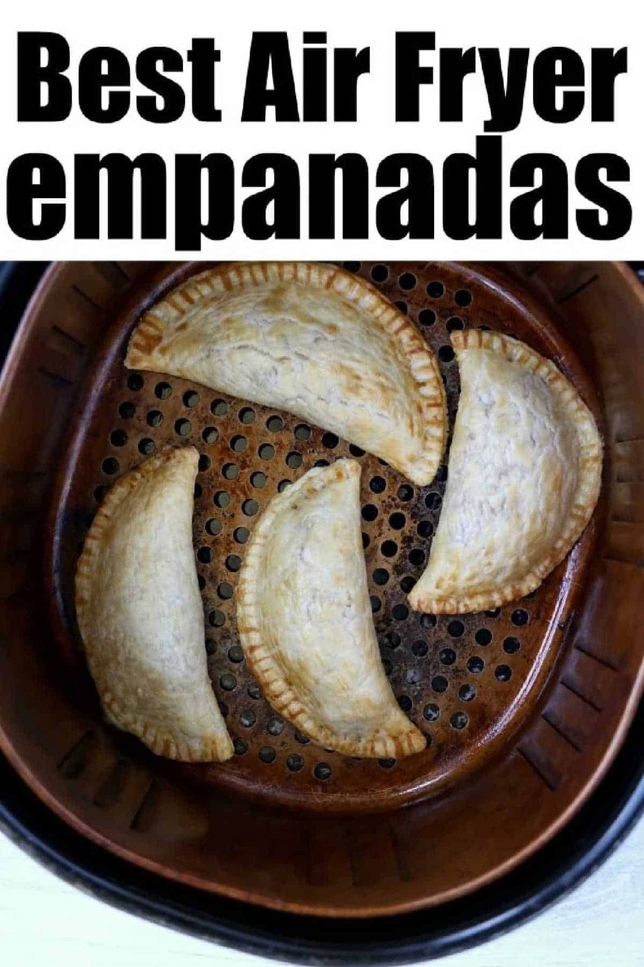 Four good air fryer empanadas cooking perfectly in the basket; text reads Best Air Fryer Empanadas.