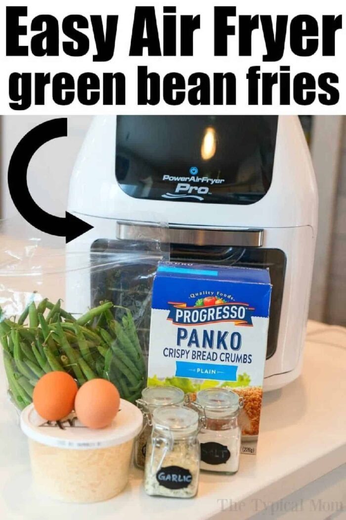 Air Fryer Green Bean Fries made with crisp green beans, eggs, Panko bread crumbs, Parmesan, garlic powder, and onion powder are arranged on a counter—solid for a healthy and good snack.