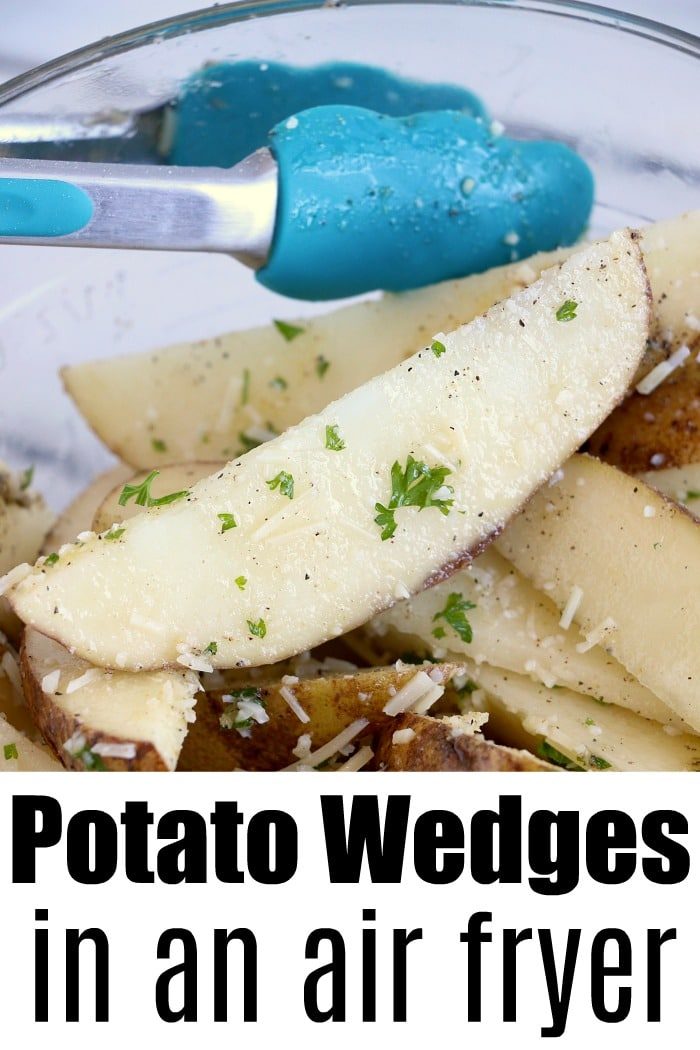 Close-up of seasoned air fryer potato wedges in a bowl with blue tongs. Text: Potato Wedges in an Air Fryer.