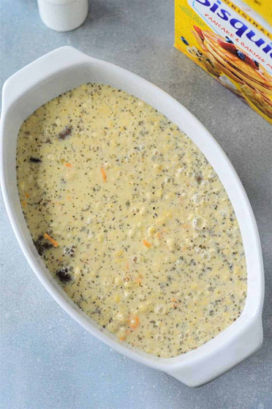 A white bowl with a good Breakfast Casserole with Bisquick in it.
