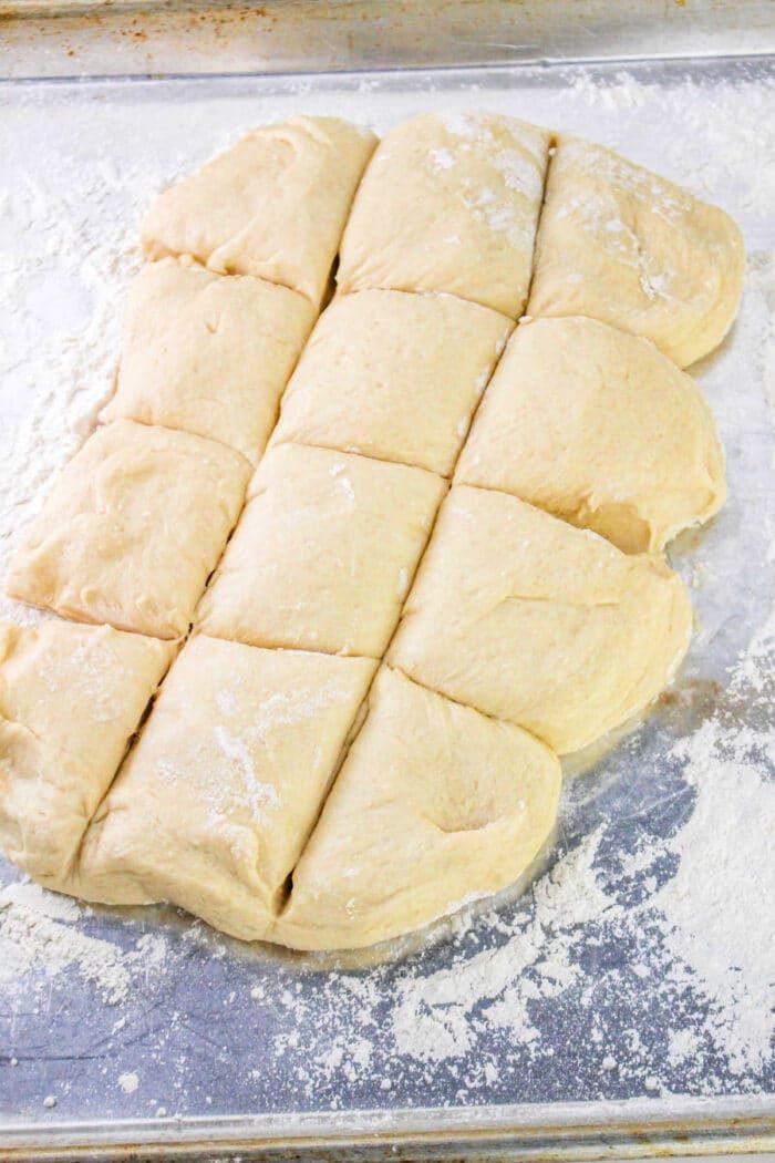 Divided dough pieces on a floured surface, ready for baking, solid for crafting your favorite Bunny Bread recipe.