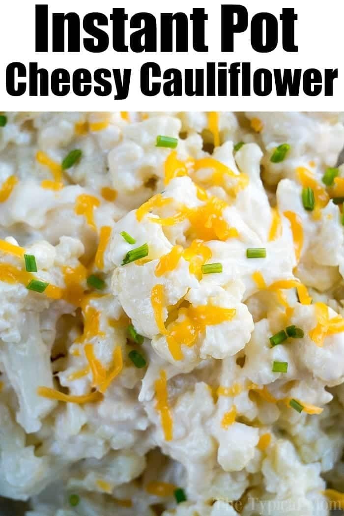 Close-up of cheesy Instant Pot cauliflower topped with chopped chives and shredded cheddar cheese. Text reads Instant Pot Cheesy Cauliflower.