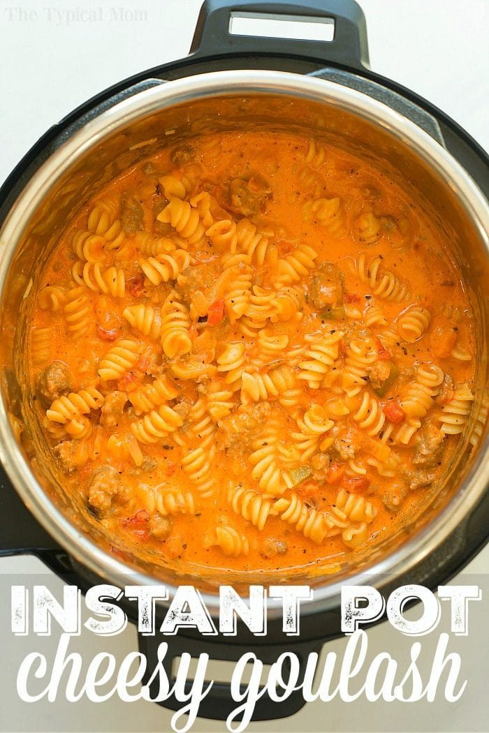An Instant Pot filled with cheesy instant pot goulash made of pasta, ground meat, and a creamy tomato sauce.