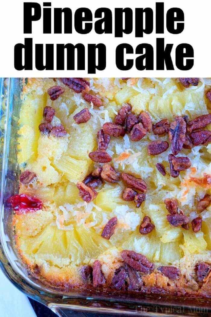 Close-up of cherry pineapple dump cake with white cake mix, topped with pecans and coconut in a glass baking dish.