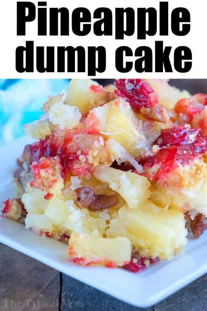 A close-up of cherry pineapple dump cake with white cake mix, featuring juicy pineapple chunks and cherry topping on a white plate.