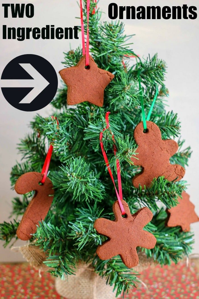A mini Christmas tree adorned with DIY two-ingredient cinnamon ornaments in various shapes, solid for those following a cinnamon ornament recipe.