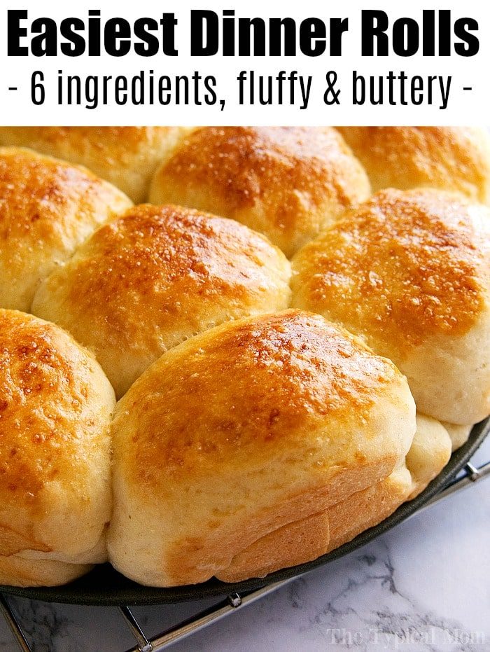 Close-up of a tray of golden-brown dinner rolls, boasting a fluffy, buttery texture with 6 ingredients. This easy roll recipe will effortlessly elevate any meal.