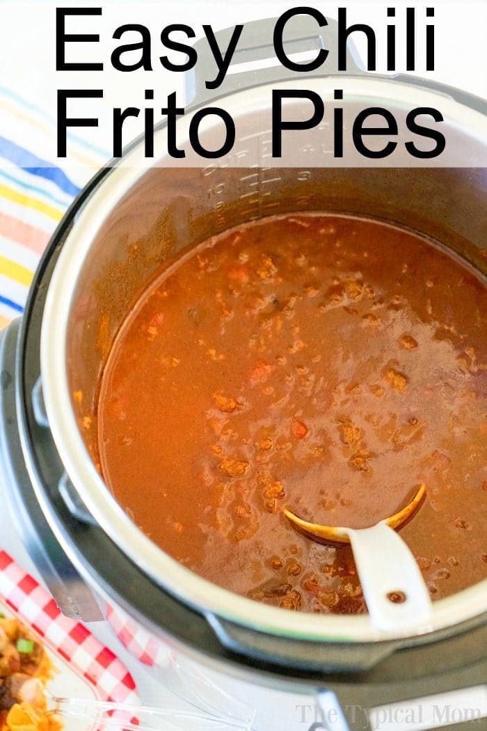 Instant Pot filled with good chili, titled "Easy Chili Frito Pies," showcases the solid Instant Pot Frito Chili Pie recipe, complete with a serving spoon inside.