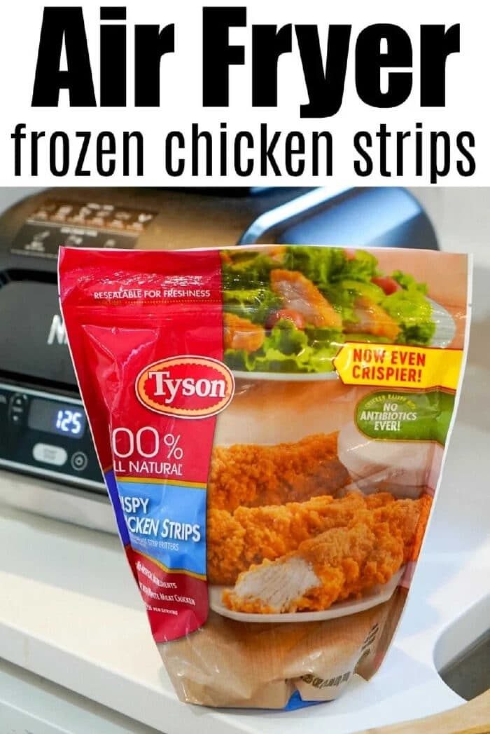 A bag of Tyson crispy chicken strips sits on a kitchen counter in front of an air fryer, ready to show how easy it is to cook frozen chicken tenders in the air fryer for a quick and tasty meal.