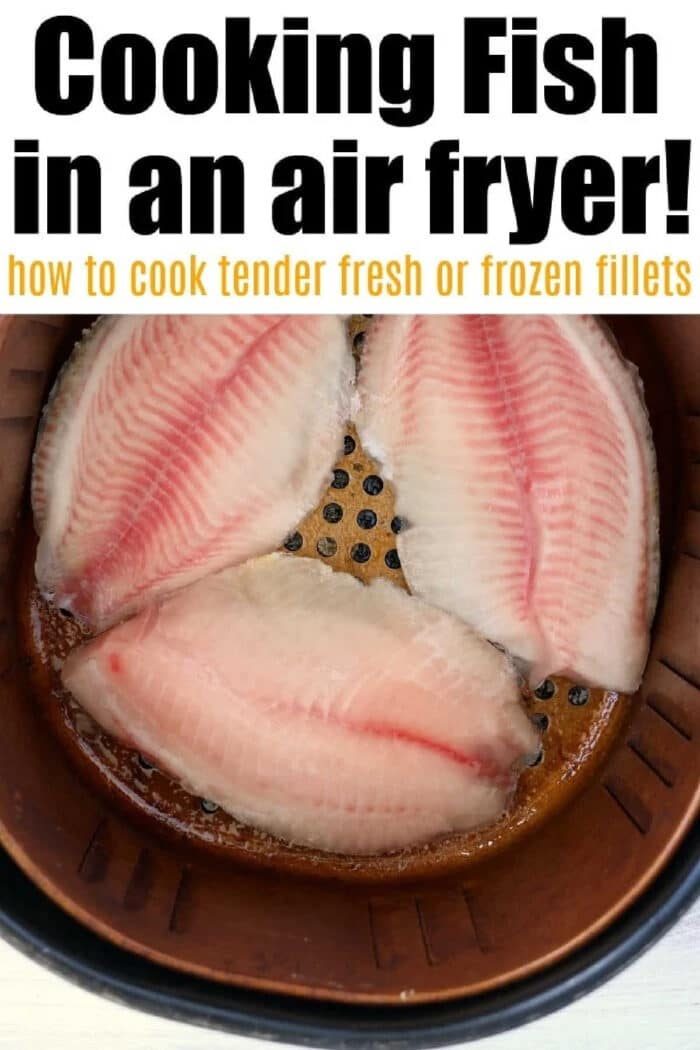 Three raw fish fillets, solid for making frozen fish in air fryer, are placed in the air fryer basket, ready to be cooked.