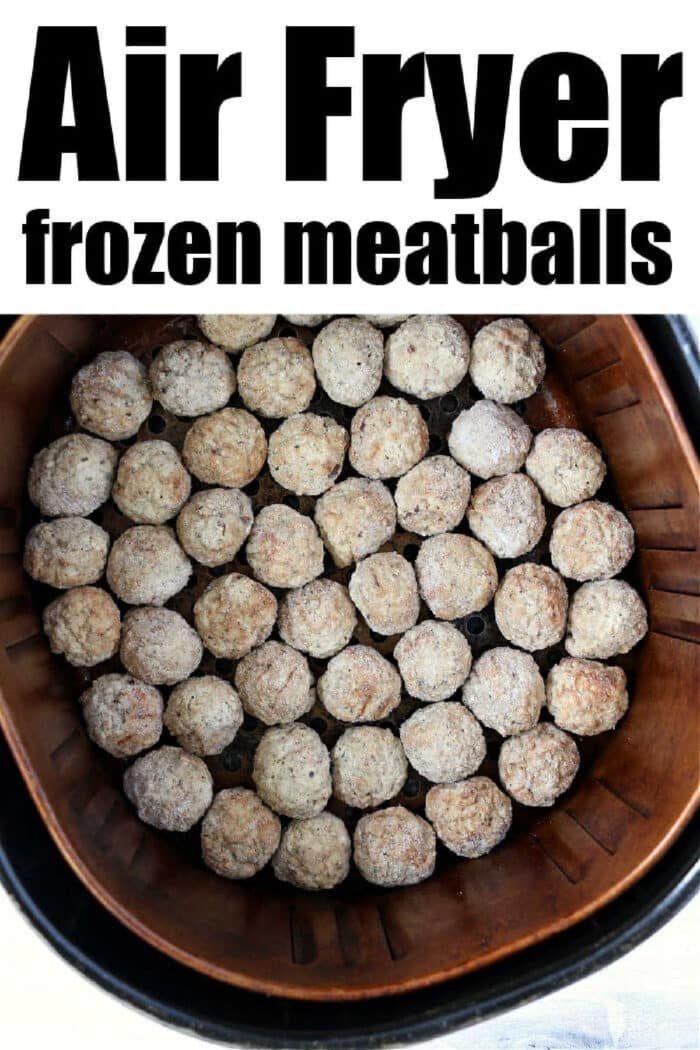 Frozen meatballs in air fryer basket, arranged in a single layer and ready to cook for quick, good results.