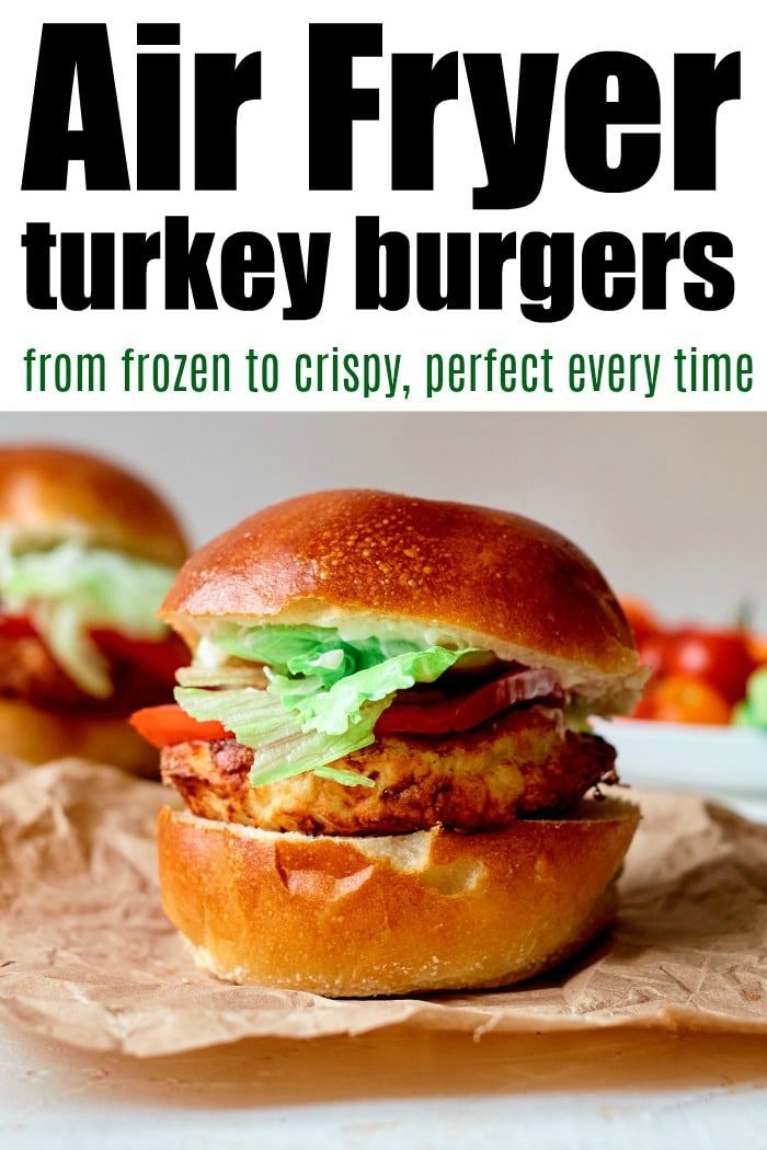 Frozen turkey burger in air fryer with lettuce and tomato on a bun, accompanied by text and another burger in the background.