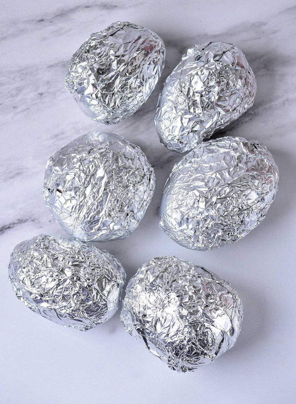Baked Potato in Oven Wrapped in Foil