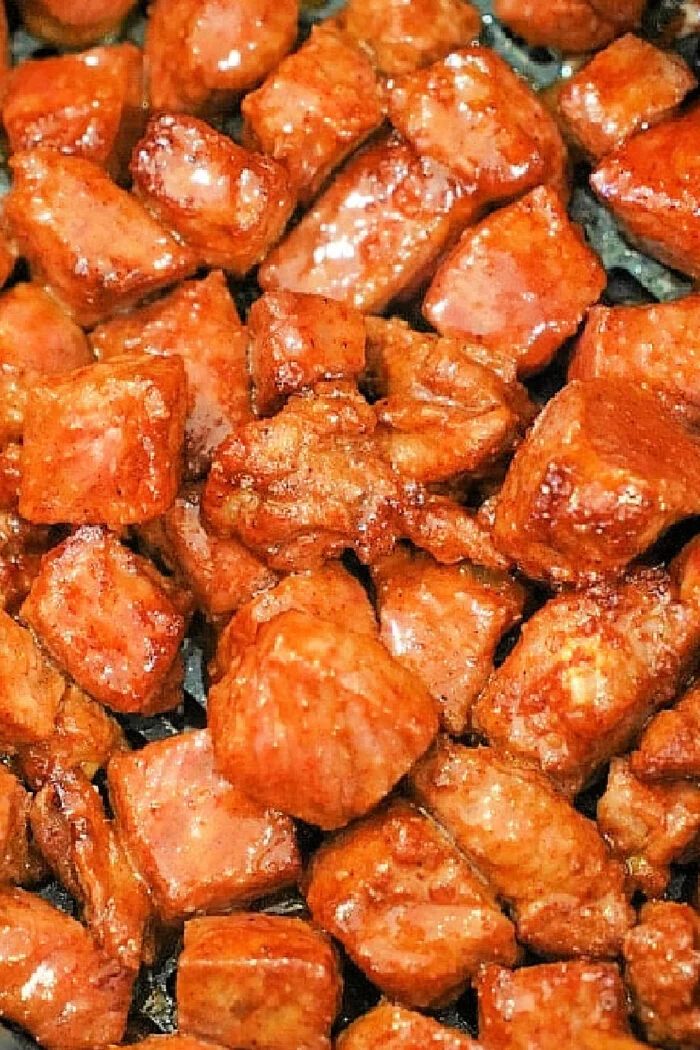 Close-up of bite-sized, glazed, and seared steak tips cooked in the oven.