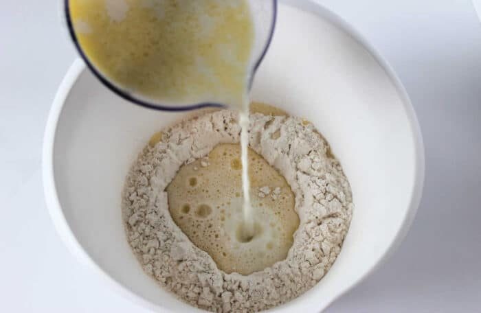 Mixing simple pancake batter, which can also be the base for learning how to make crepes with pancake mix—add extra milk until you reach the desired thinness.