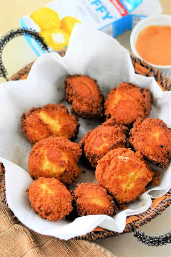 Golden-brown Jiffy hush puppies with a crispy exterior and soft, fluffy interior.