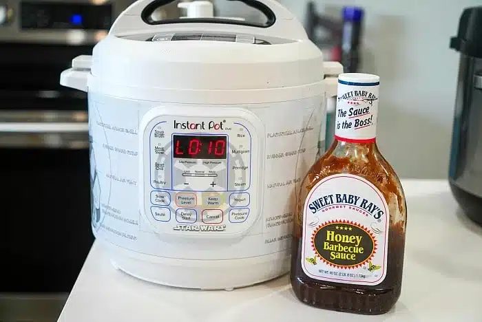 A Star Wars-themed Instant Pot sits on the kitchen counter alongside a bottle of Sweet Baby Ray's Honey Barbecue Sauce—solid for whipping up good instant pot BBQ beef.