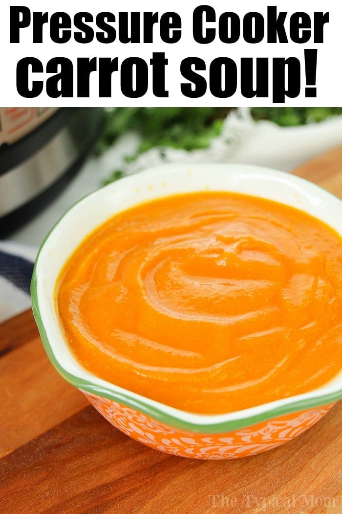A bowl of smooth orange carrot soup sits on a table, with text above that reads "Pressure Cooker Carrot Soup!" Discover how to cook carrots to perfection and enjoy this velvety delight.