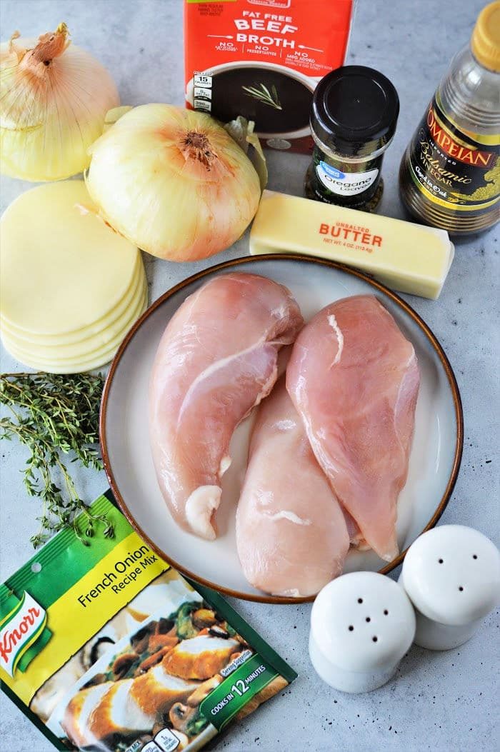 Raw chicken breasts, onions, cheese, beef broth, butter, olive oil, thyme, seasoning, and French onion soup mix come together for a good Instant Pot French Onion Chicken dinner.