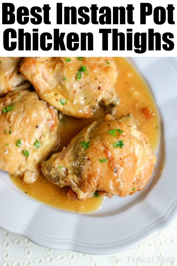 A plate of Instant Pot Honey Mustard Chicken showcases tender chicken thighs draped in a good sauce, garnished with fragrant herbs.