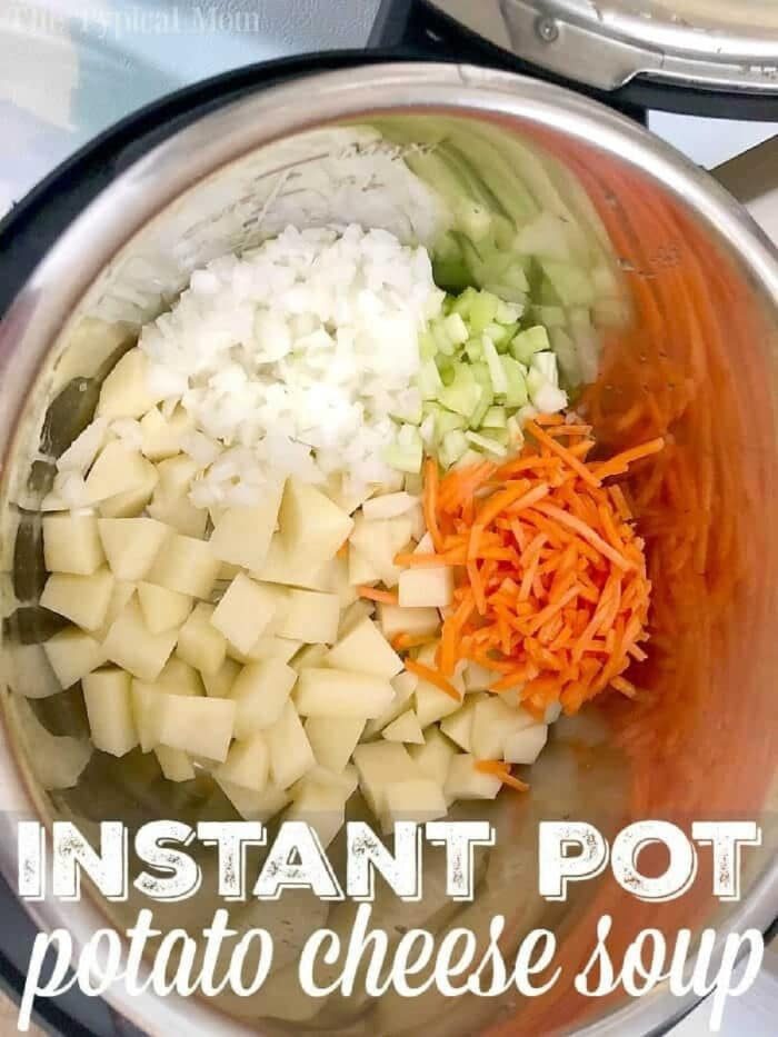 Chopped potatoes, onions, celery, and shredded carrots are prepped in the Instant Pot for a comforting instant pot potato cheese soup.