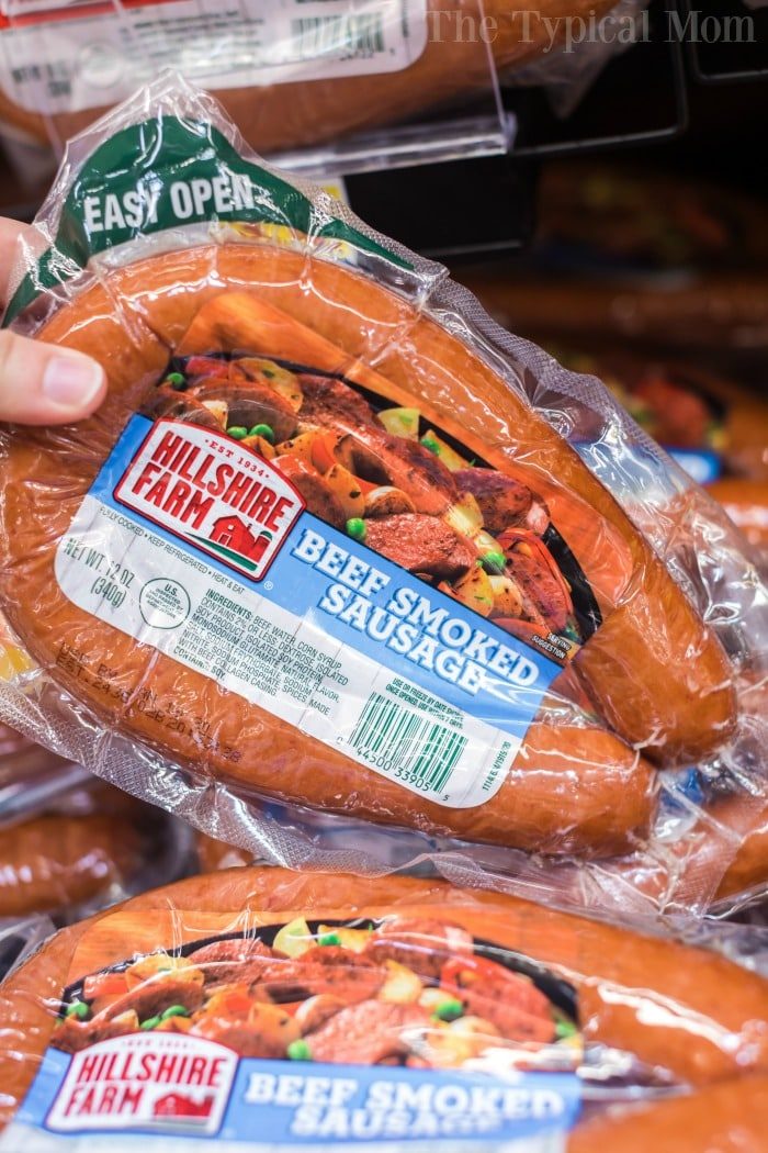 Package of Hillshire Farm beef smoked sausage displayed in a store aisle, solid for a quick and tasty meal.