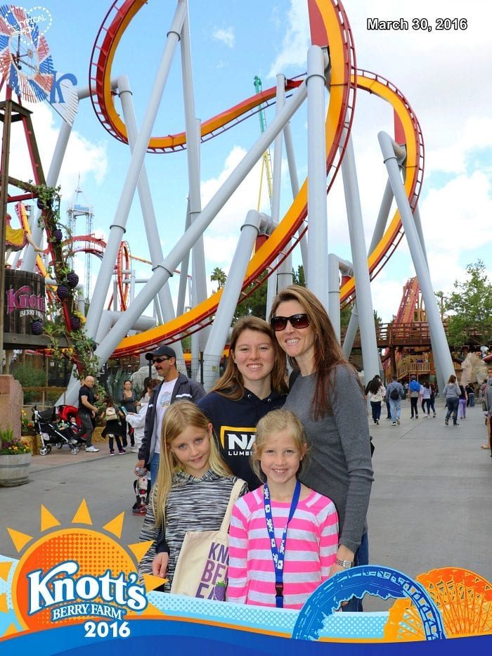 Family of four captured in a Knott's Berry Farm FunPix moment, posing with smiles and excitement in front of a roller coaster, dated March 30, 2016.