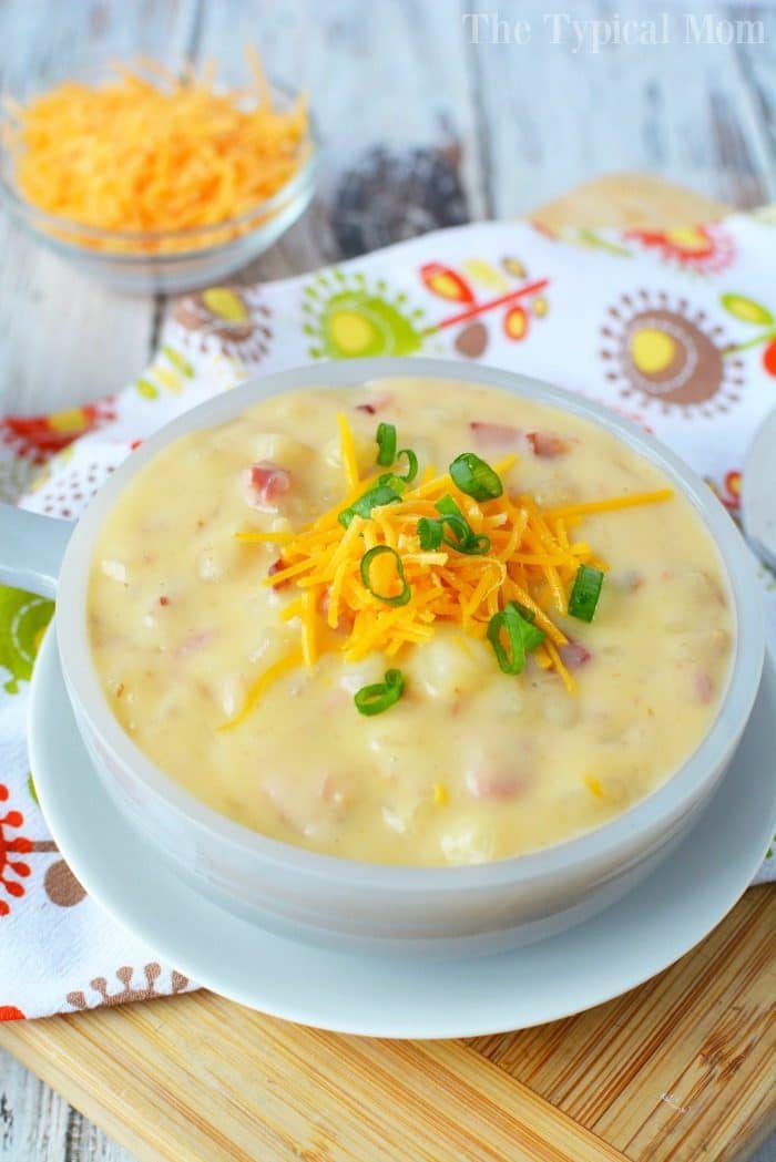 This totally loaded baked potato soup in the crockpot is super easy recipe to make and so good! You only need a few ingredients and it only costs about $10 to feed up to 6 people. Stovetop and pressure cooker potato soup instructions included too so you can cook it any way you want. #potato #soup #loaded #crockpot #slowcooker #pressurecooker #cheese