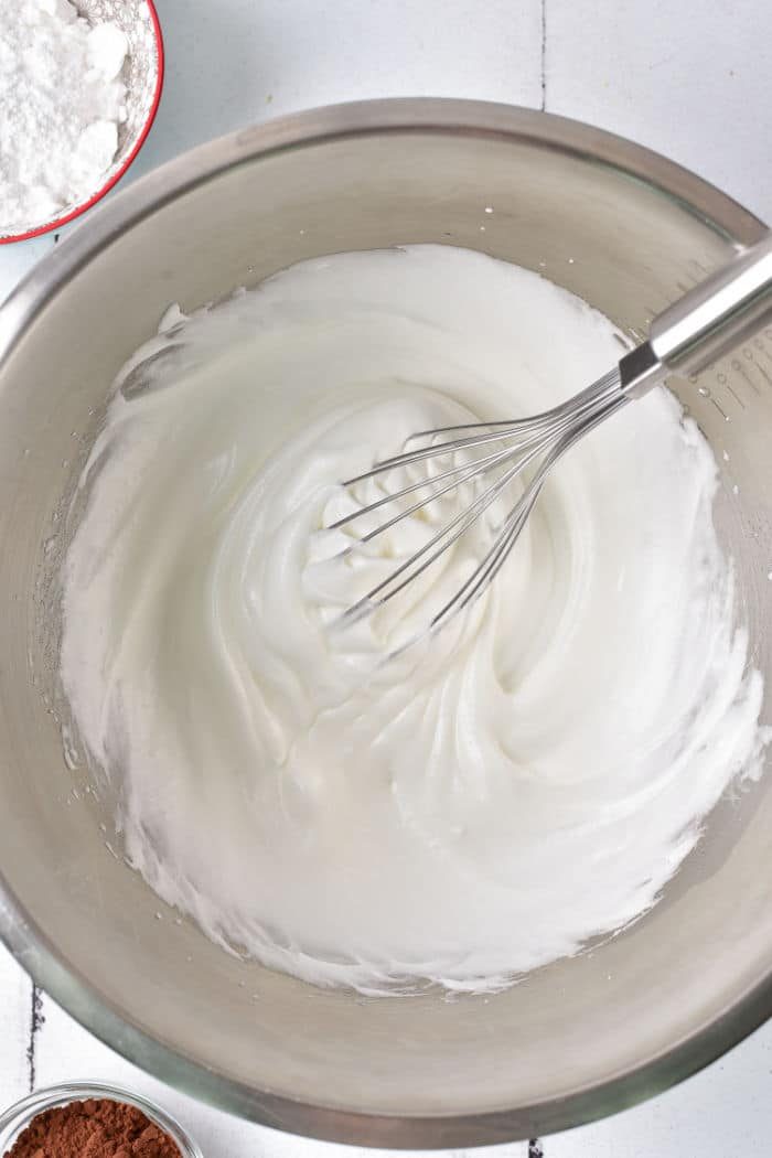 Whisk in a mixing bowl with fluffy, whipped egg whites for the solid meringue.