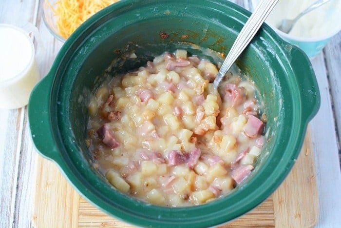 This totally loaded baked potato soup in the crockpot is super easy recipe to make and so good! You only need a few ingredients and it only costs about $10 to feed up to 6 people. Stovetop and pressure cooker potato soup instructions included too so you can cook it any way you want. #potato #soup #loaded #crockpot #slowcooker #pressurecooker #cheese 2