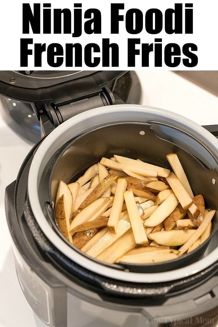 Cut fresh potatoes into solid fries with the Ninja Foodi, ready to transform into crispy, golden French fries.