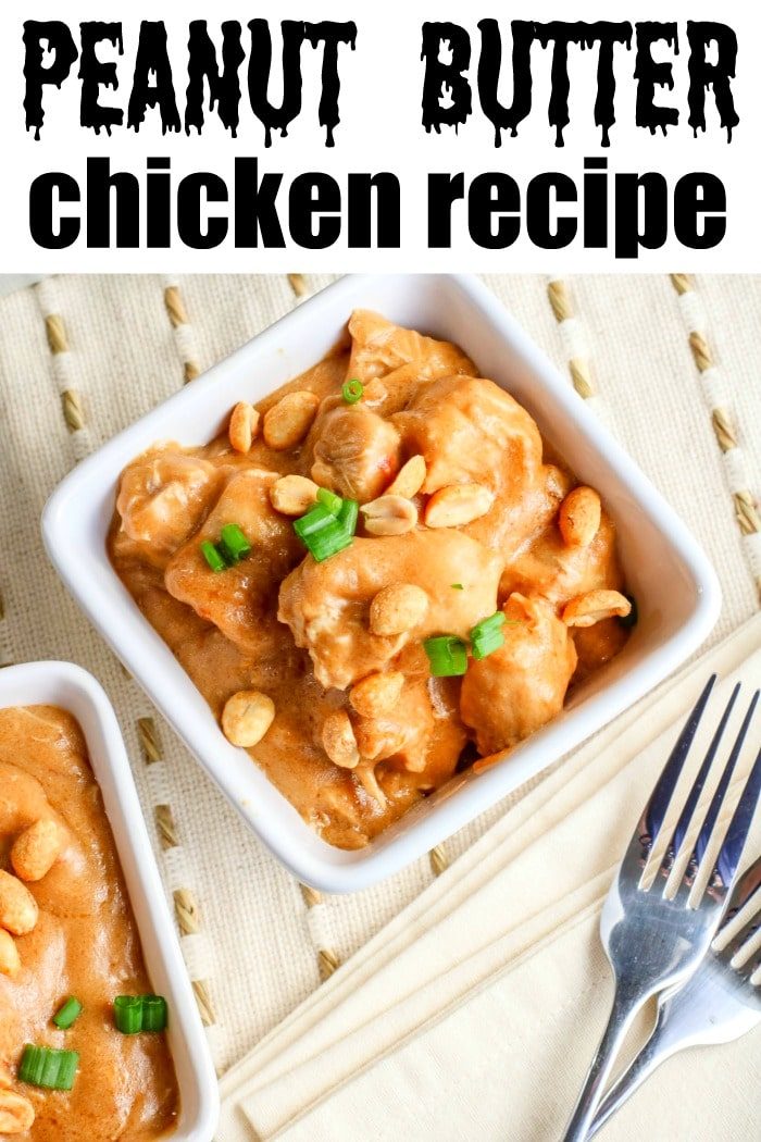 A good peanut butter chicken recipe featuring a bowl of tender chicken garnished with peanuts and green onions, with a fork placed invitingly beside it.