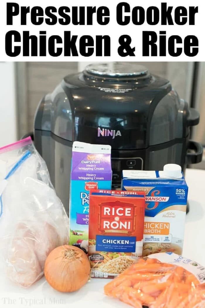 Ingredients for creamy chicken and rice casserole in front of a Ninja pressure cooker: chicken, cream, rice mix, broth, onion, and carrots.