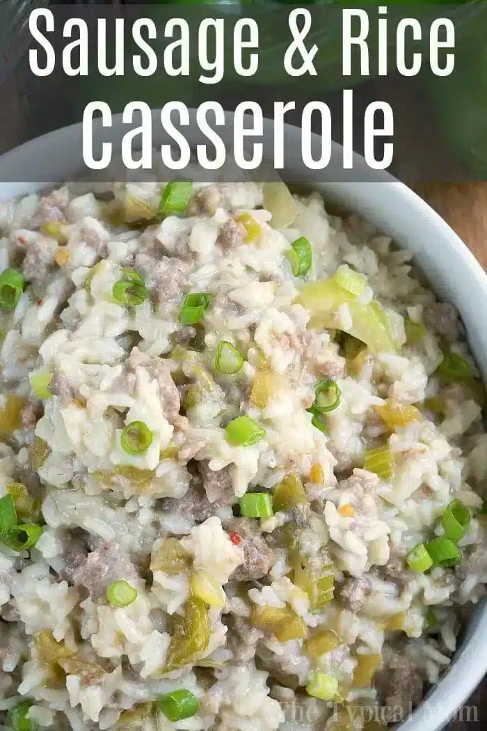 A close-up of an Instant Pot sausage and rice casserole in a white bowl. The dish is garnished with chopped green onions, showcasing a savory mixture of rice, sausage, and green peppers. The image features text reading "Sausage & Rice Casserole.