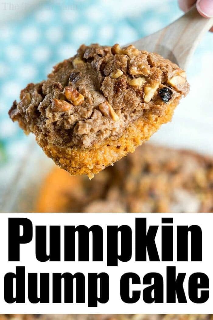 A wooden spoon holds a serving of pumpkin pie dump cake, topped with nuts and crumble.