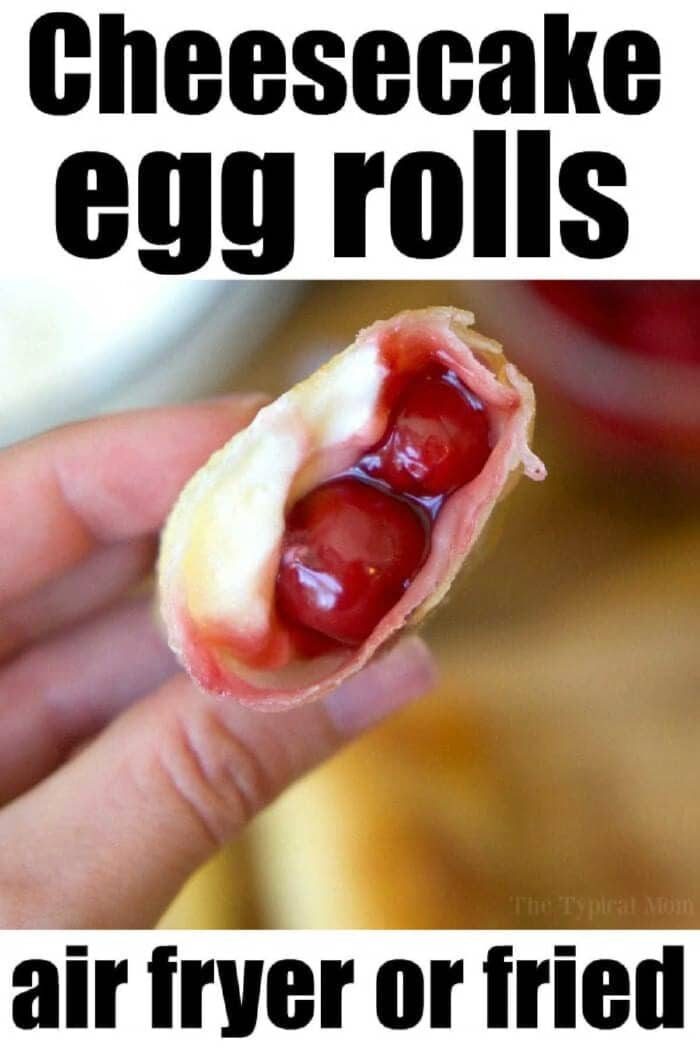 A hand holds a cheesecake egg roll filled with cherries and cream, highlighting good recipes using egg roll wrappers—solid for air fryer or fried options.