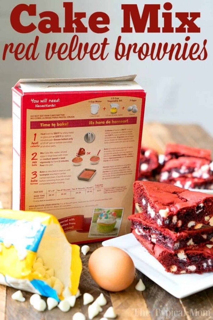 A box of red velvet cake mix is paired with an egg and chocolate chips, ready to create good red velvet brownies from cake mix on your table.