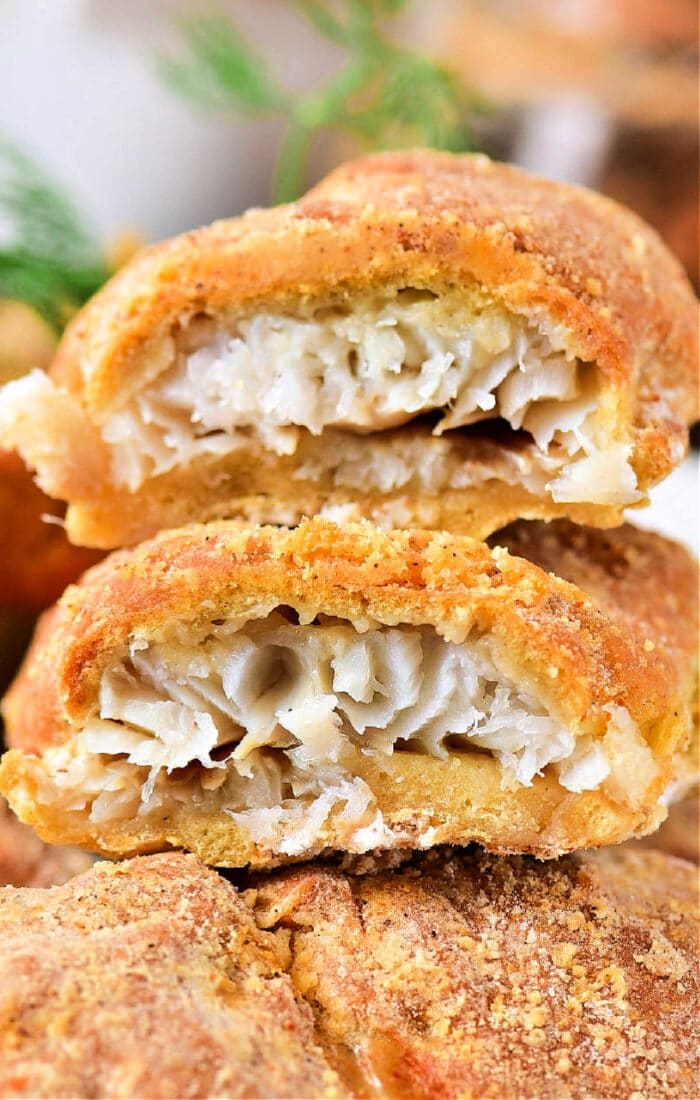Close-up of a fried fish showcasing a crispy golden-brown crust thats begging to be reheated in an air fryer for that solid crunch.