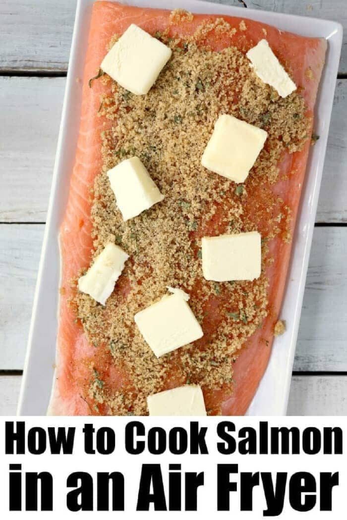 Raw salmon fillet topped with brown sugar and butter on a white tray, ready to show you how to make good salmon in the air fryer. Text: How to Cook Salmon in an Air Fryer.