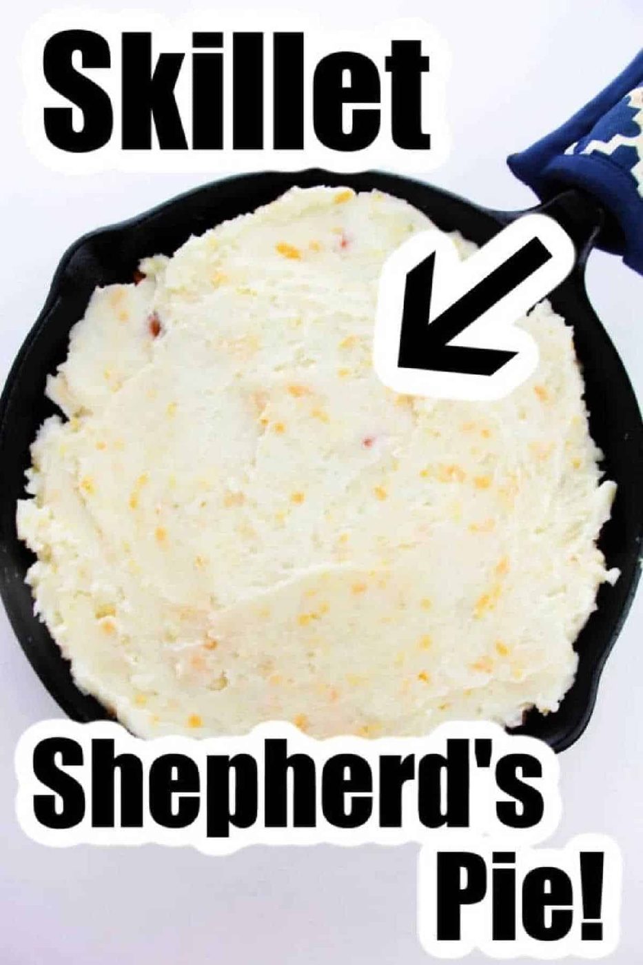 A skillet filled with mashed potatoes labeled Shepherd's Pie with Instant Potatoes! with a bold arrow pointing to it.