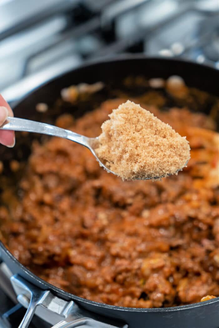 A spoonful of brown sugar held over a pot of simmering ground meat, the irresistible aroma beckons as the solid prelude to delectable Sloppy Joes.