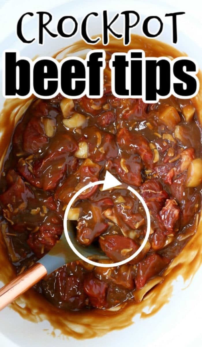 Beef tips in brown sauce in a crockpot, being stirred with a spoon. Text reads Slow Cooker Beef Tips.