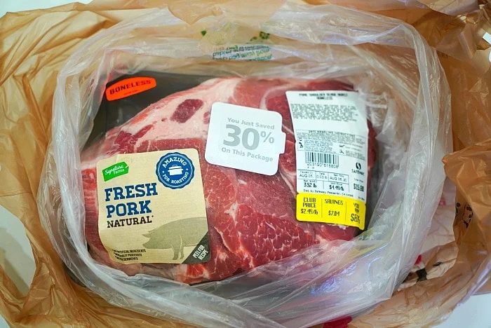 Packaged fresh boneless pork, labeled Natural, nestled in a plastic bag with a 30% discount sticker—solid for crafting your own smoked pulled pork on any Traeger grill.