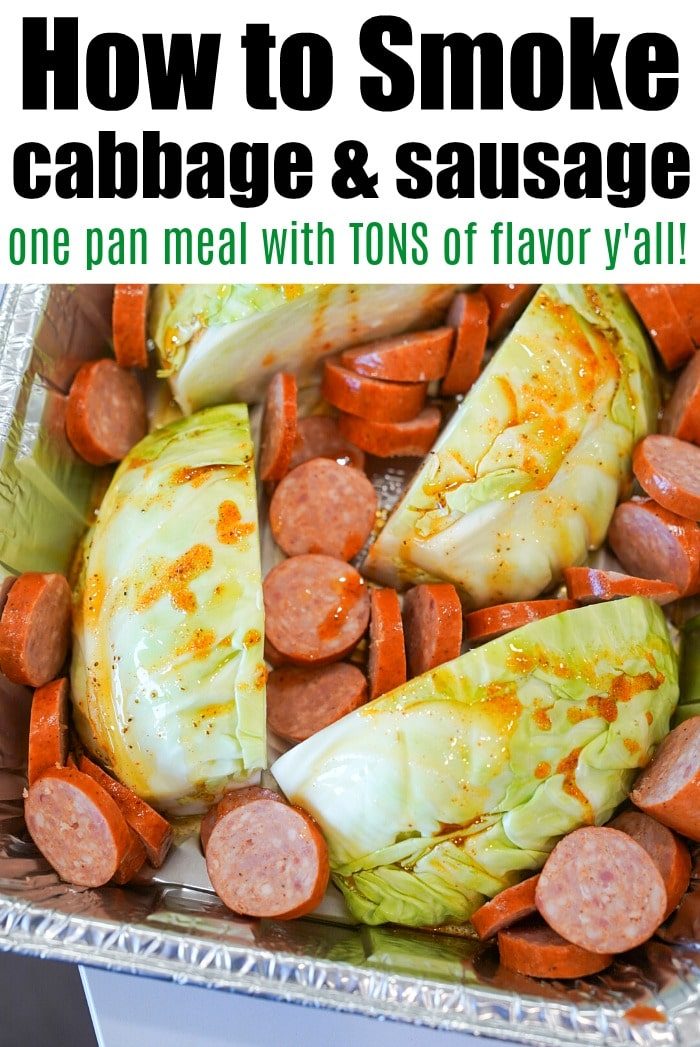 Chopped cabbage and smoked sausage slices rest in a foil tray, seasoned to perfection and ready for smoking. Text reads: How to smoke cabbage & sausage, one-pan meal with TONS of flavor y'all!