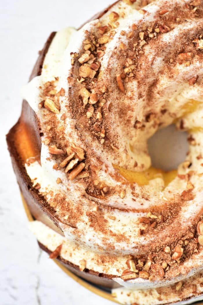 A good bundt cake topped with white icing, crushed nuts, and cocoa powder, this creation offers a delightful twist on the classic Sock it to us cake recipe with cake mix. Seen from above, its an irresistible treat for any dessert lover.